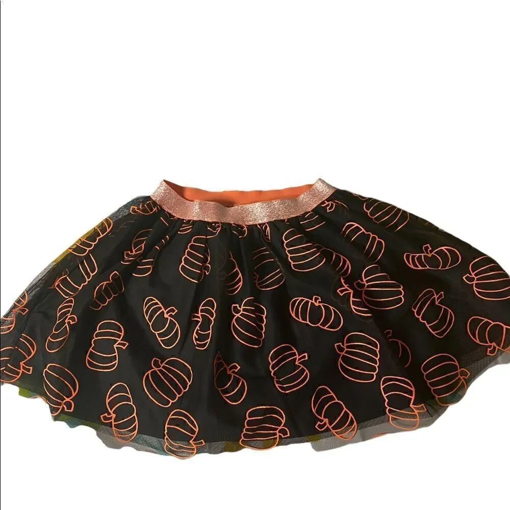 Black tutu orange pumpkins adorn this adorable fall Cat & Jack skirt
